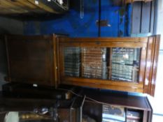 Mahogany display cabinet with glazed bookshelf over cupboards