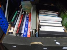 A box of military books and DVDs