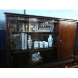 Mahogany floor standing glazed bookcase with slide doors and a single cupboard