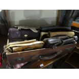 Vintage leather suitcase containing ladies handbags and purses, including leather, crocodile skin,