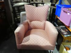 Pink bedroom chair on castors