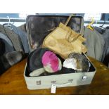 Vintage suitcase containing various hats incl. 1920s bird feather half hat by Edward French, 1950s