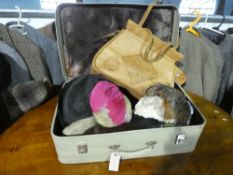 Vintage suitcase containing various hats incl. 1920s bird feather half hat by Edward French, 1950s