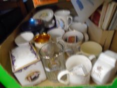 Box of commemorative items, to include: royal mugs and box of vintage tins and old telephones.