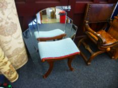 A reproduction art deco style wall mirror and a dressing stool