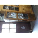 A free standing G-Plan wooden two door display cabinet with 3 shelves.