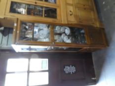 A free standing G-Plan wooden two door display cabinet with 3 shelves.