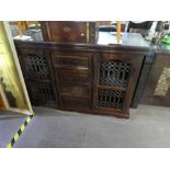 Indian style sideboard with two metal lattice doors with 4 drawers
