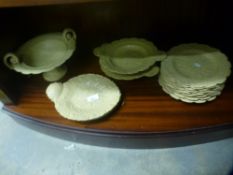 A selection of cream drabware incl plates, designed with leaves and flowers