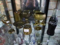 Small shelf of brassware and Coca-Cola radio