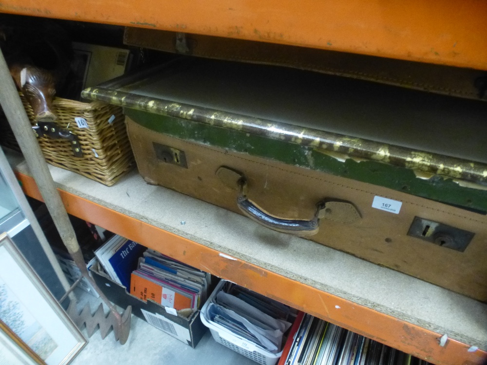 A leather travelling case containing mirrors and paper prints and a picnic basket, etc