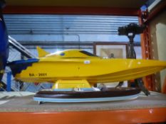 Two model boats, one being radio-controlled
