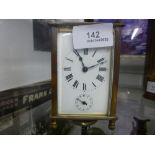 Small brass carriage clock, with key