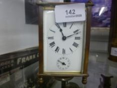 Small brass carriage clock, with key