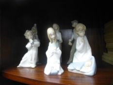 Five Lladro figures of children and another