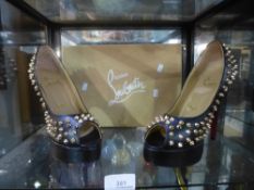 A pair of size 5 black shoes studded marked Christian Louboutin