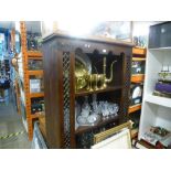 A large wooden open bookcase with 3 shelves and two drawers