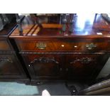 A pair of mahogany sideboards, with brass hands and decorative doors