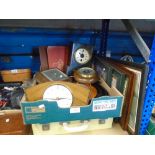 A mixed box of collectables including stamp albums clocks and a cased picnic set with contents and