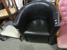 Black faux leather swivel chair on a square base and another tub chair.