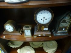 Three mantle clocks and a carriage clock