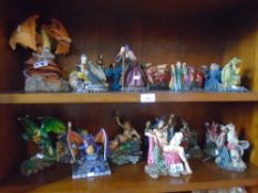 Large collection of myths and fantasy figurines including dragons, wizards, etc