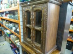 Two chunky carved wooden storage units, one with 4 drawers and an open cupboard, with lattice