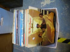 A box of old LPs of various themes