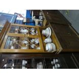 Waxed pine kitchen dresser with glazed doors above drawers and cupboards