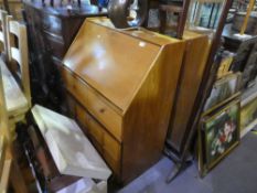 Teak writing bureau with pigeon holes and drawer inside and two drawers over two doors