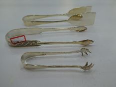 Three silver plate and white metal tongs, one being Arthur Price