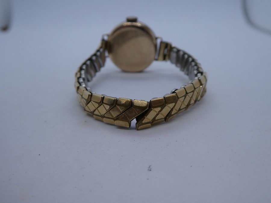Vintage 9ct gold cased ladies wristwatch 'J W Benson' case marked 375, on rolled gold strap - Image 3 of 3