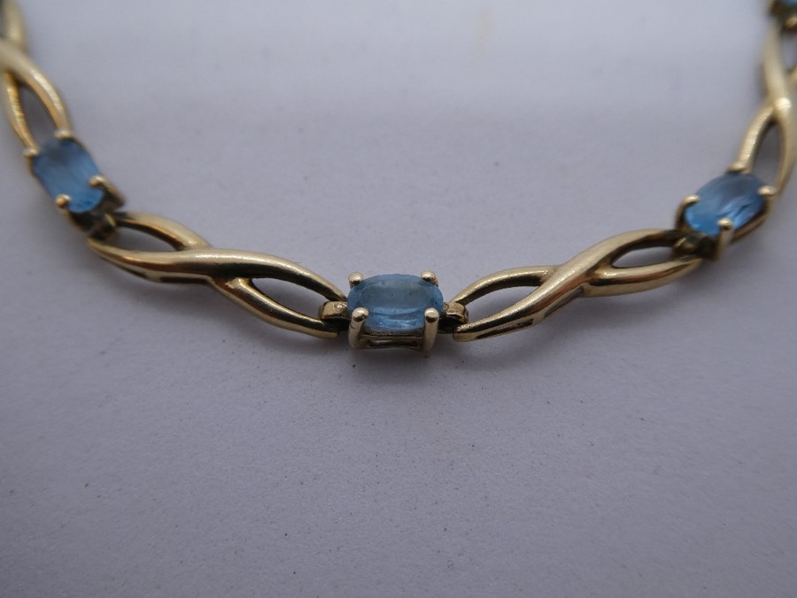 Pretty 9ct yellow gold bracelet set with 9 pale blue stones, marked 375 - Image 2 of 4