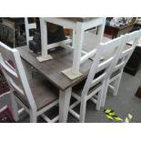 A modern white painted extending dining table and six chairs