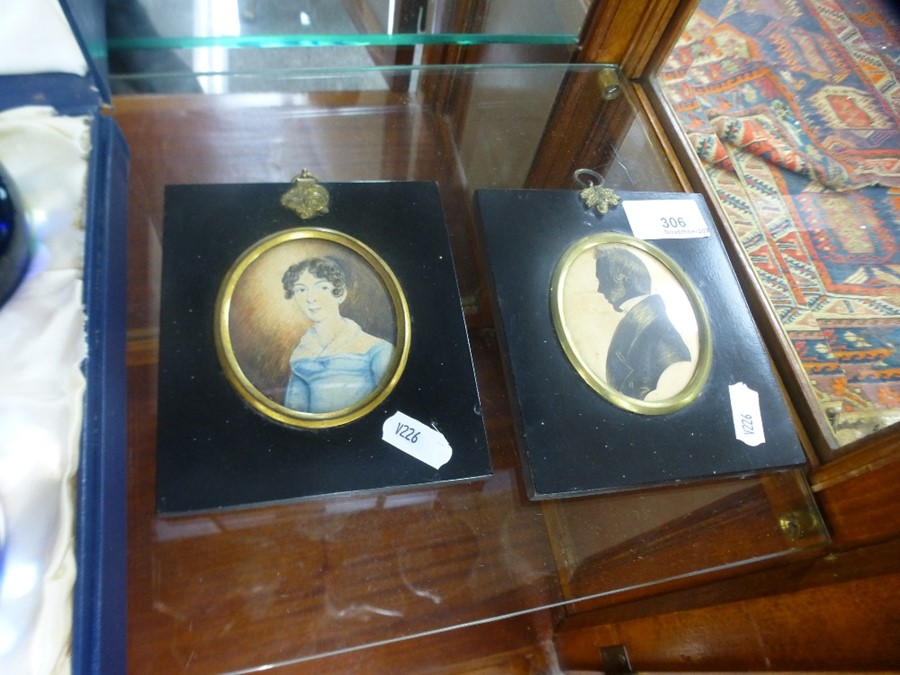 An early 19th Century miniature portrait of lady unsigned and a silhouette portrait miniature