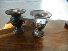 A pair of small oriental bronze vases having flared rims