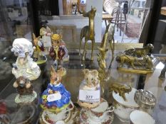 Various Beatrix Potter figures and other metalware items