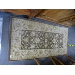 A Ziegler style brown and cream rug, 151 x 79 cms