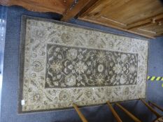 A Ziegler style brown and cream rug, 151 x 79 cms