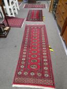 Six small modern Bukhara rugs, having elephant pad design