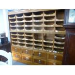 A vintage oak Haberdasher's shop unit having 45 sliding trays with eight drawers below - 3 trays mis