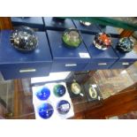 Caithness; a set of four Elements II paperweights in case, 234/750 and four other limited edition pa