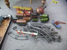 A vintage tin plate fire engine, probably German, two Meccano tin plate locomotives and tenders, rol