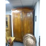 A large French cherrywood armoire having two doors