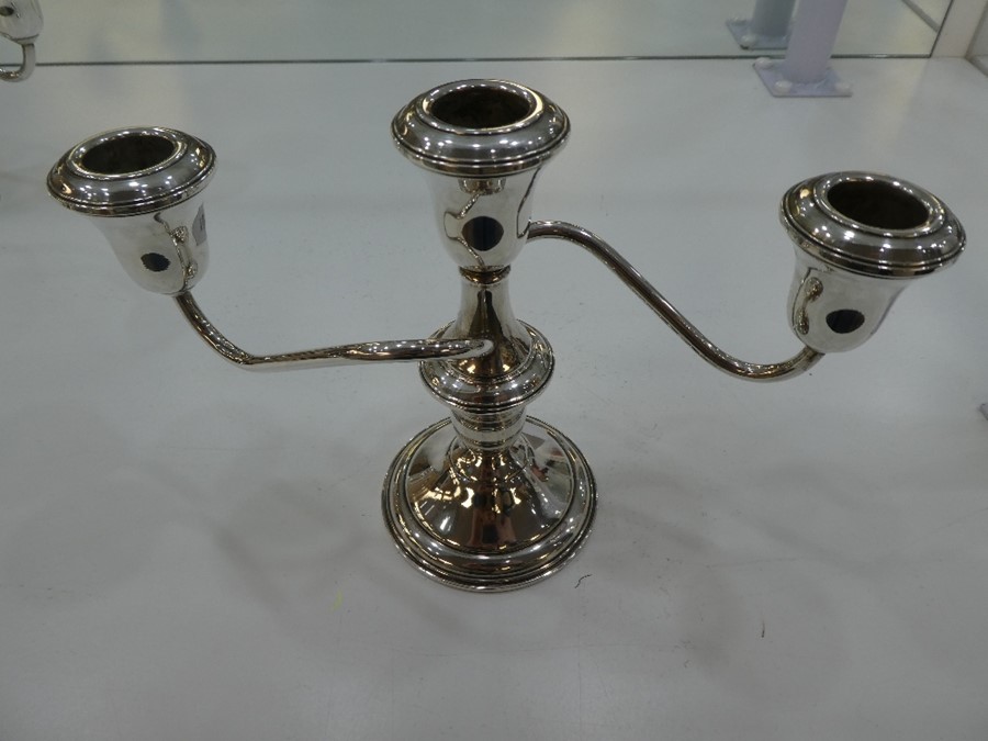 A pair of silver candelabras marked 'Lord Silver inc silver weighted' - Image 4 of 4