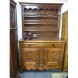 An antique French buffet having Yew wood doors and drawer front with inlaid decoration and a rackbac