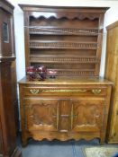 An antique French buffet having Yew wood doors and drawer front with inlaid decoration and a rackbac