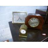 An Art Deco brass easel clock having silvered dial and two other clocks