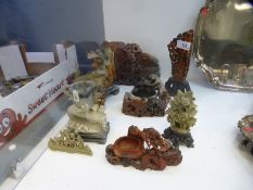 A quantity of Oriental soapstone carvings