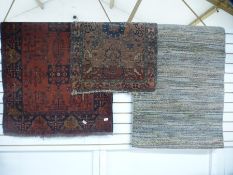 A modern Gabbeh rug, 160 x 13 cms and two other rugs